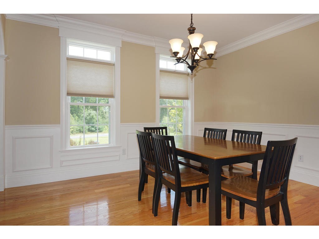 50 Fox Run Road Bolton, MA 01740 - Photo 5 of 20 a view of a dining room with furniture and chandelier