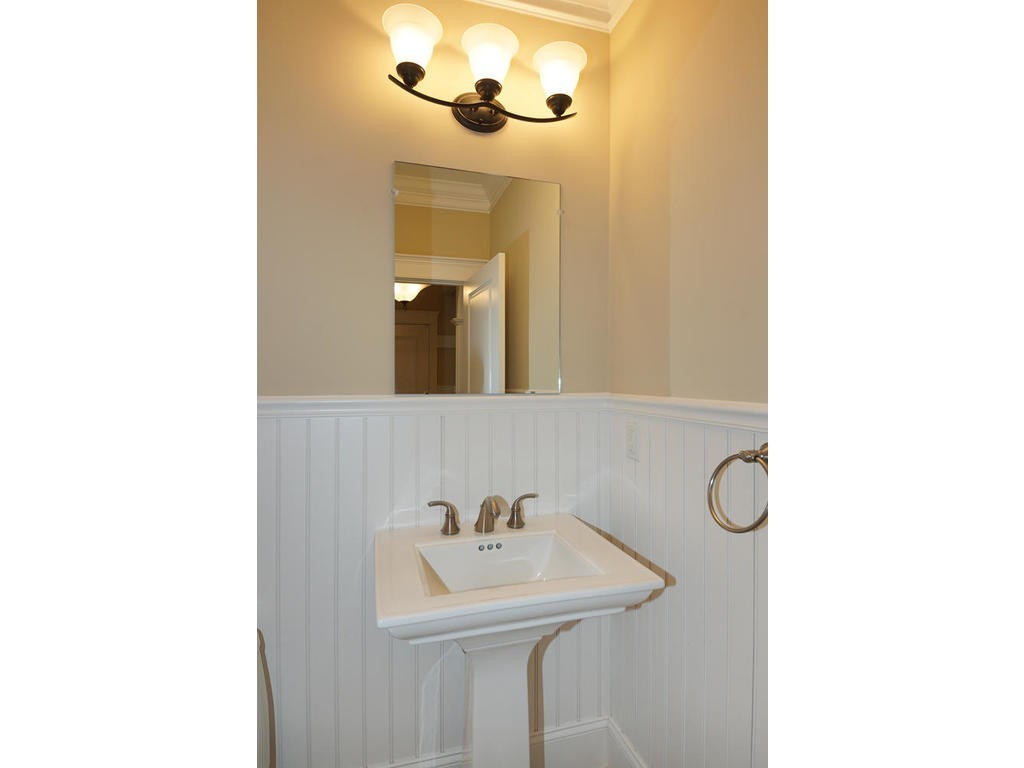 50 Fox Run Road Bolton, MA 01740 - Photo 7 of 20 a bathroom with a sink a mirror and a light fixture