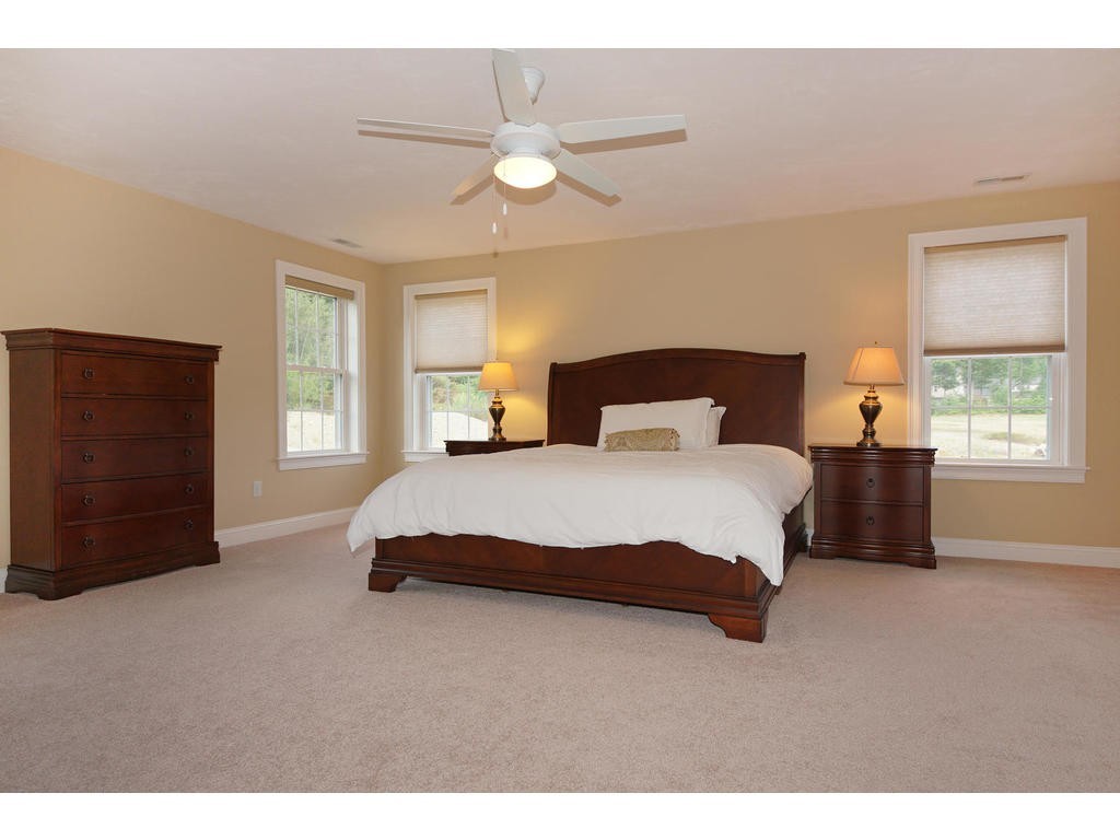 50 Fox Run Road Bolton, MA 01740 - Photo 10 of 20 a spacious bedroom with a bed and a window