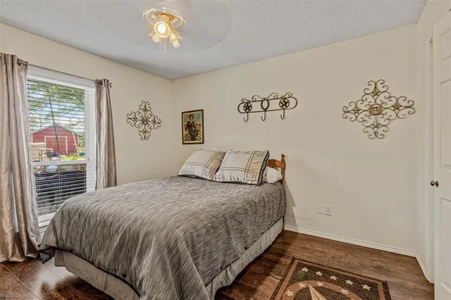 a bathroom with a toilet sink washing machine and mirror