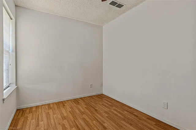 a bathroom with a shower a toilet and a sink