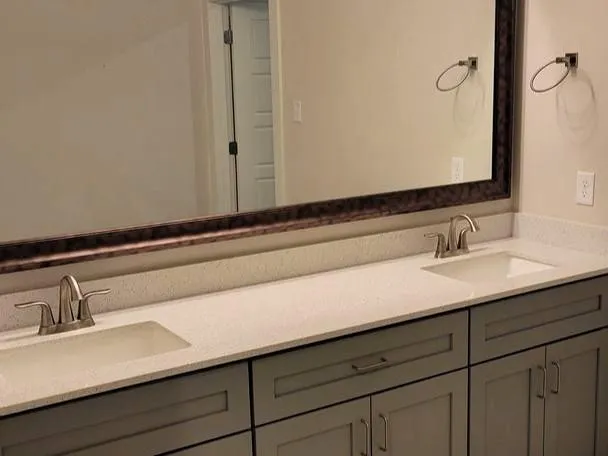 a bathroom with a sink and mirror