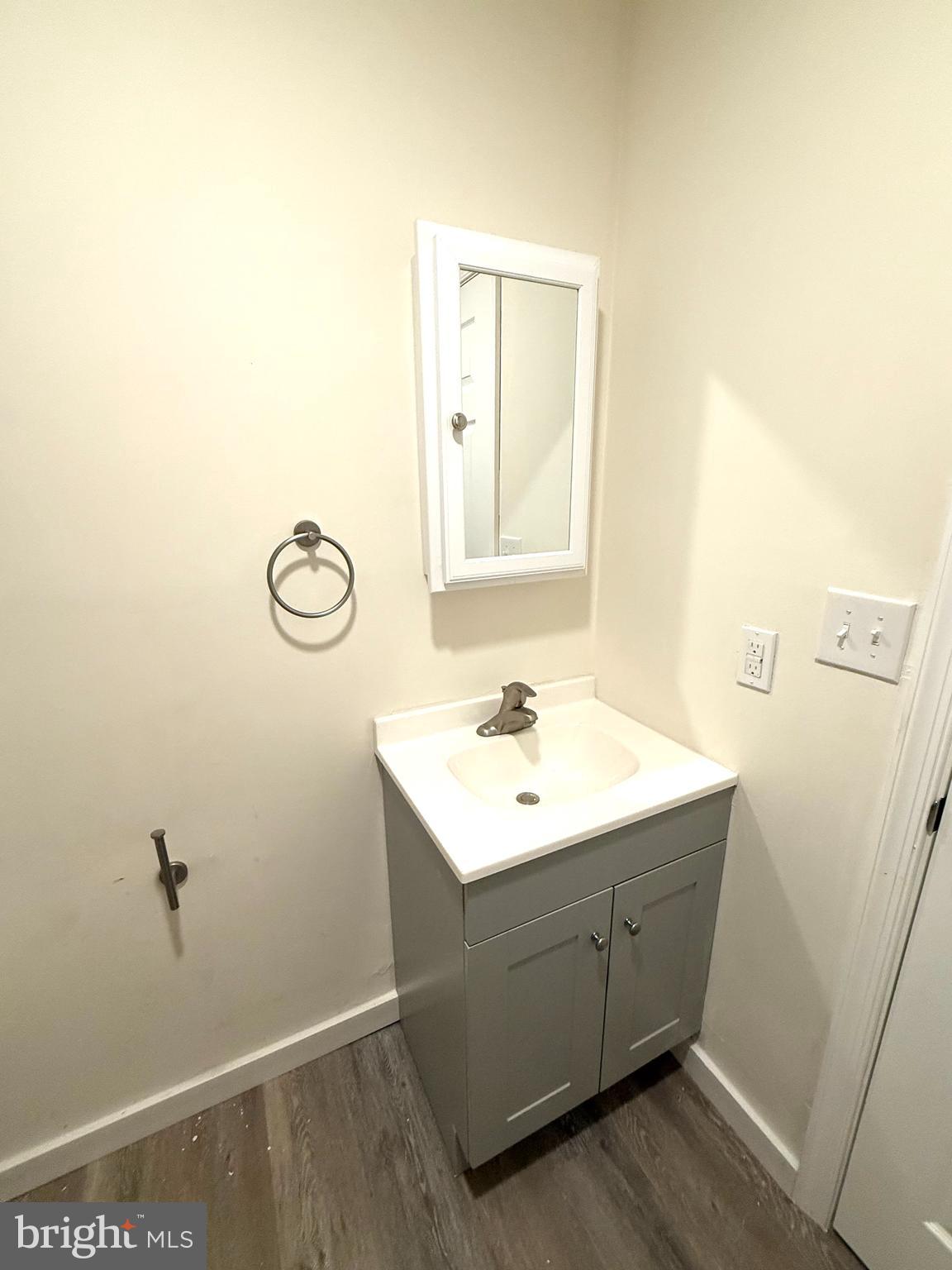 124 Spruance Road Dover, DE 19901 - Photo 16 of 17 a bathroom with a sink and a mirror