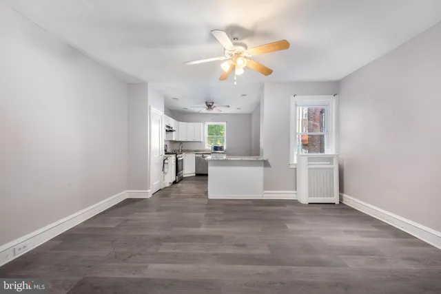 a view of a kitchen with microwave and cabinets