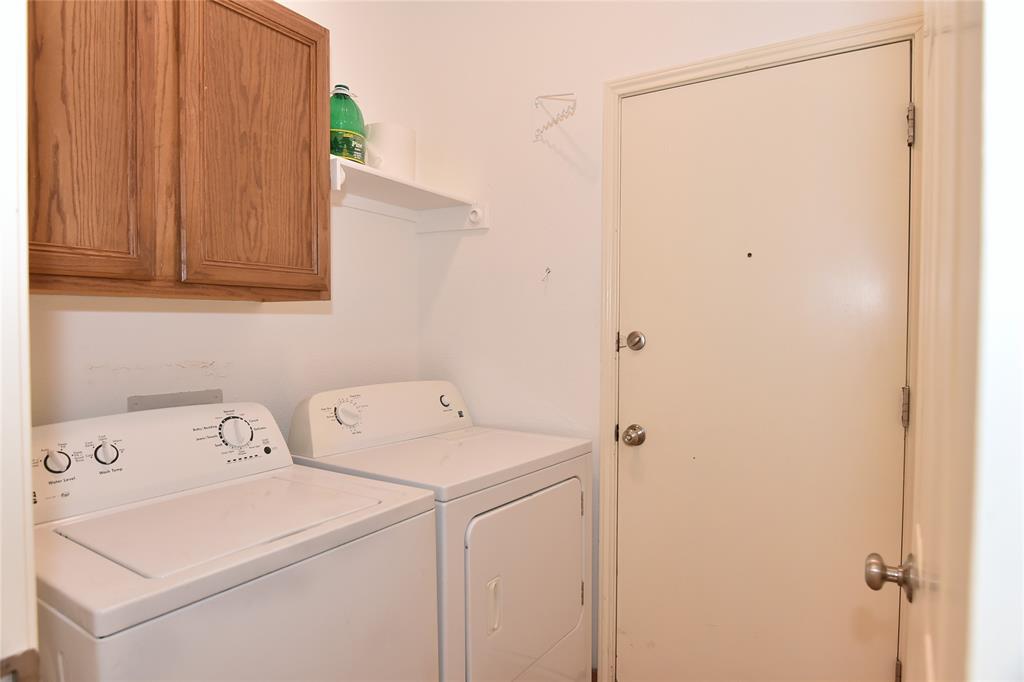 1503 Natural Bridge Lane Pflugerville, TX 78660 - Photo 13 of 20 a utility room with dryer and washer