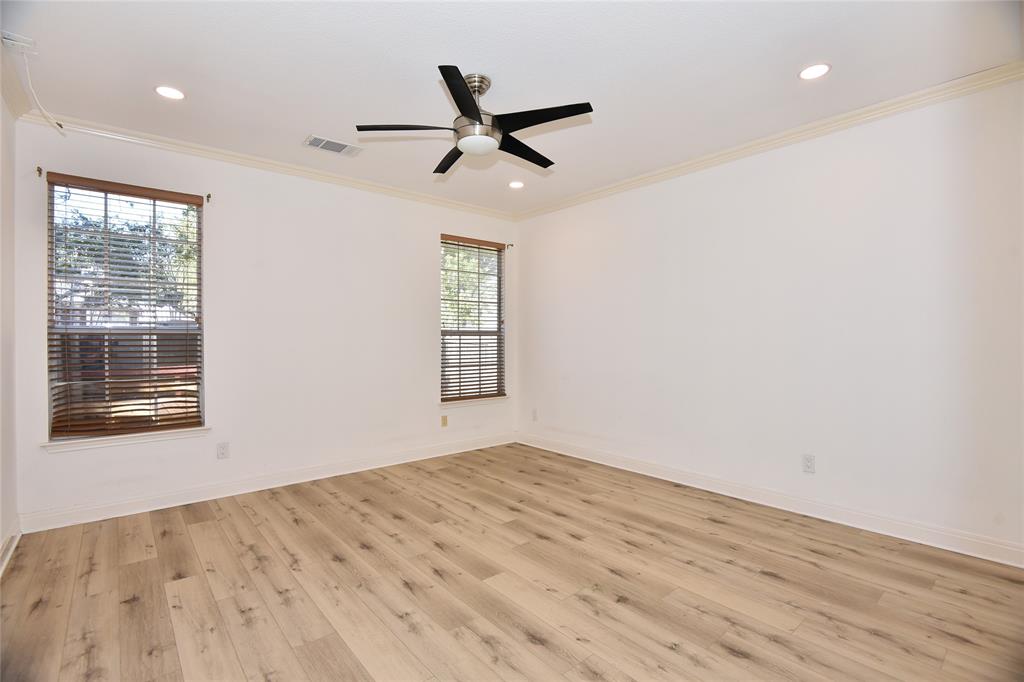 1503 Natural Bridge Lane Pflugerville, TX 78660 - Photo 14 of 20 a view of empty room with wooden floor and fan