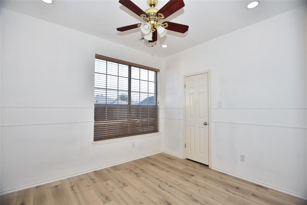 1503 Natural Bridge Lane Pflugerville, TX 78660 - Photo 2 of 20 wooden floor in an empty room with a window
