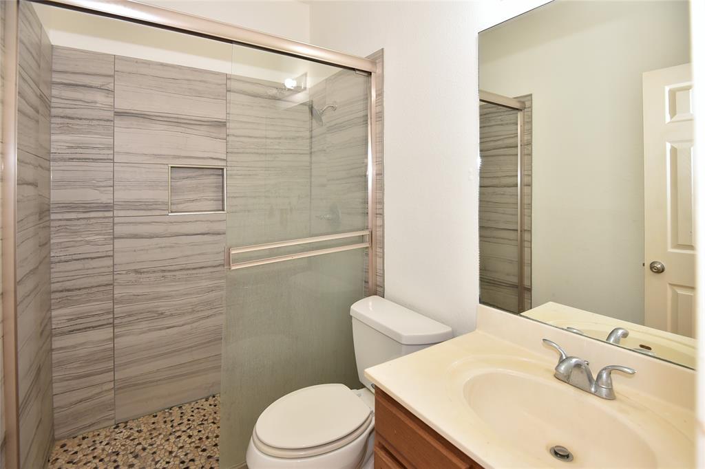 1503 Natural Bridge Lane Pflugerville, TX 78660 - Photo 6 of 20 a bathroom with a sink a toilet and shower