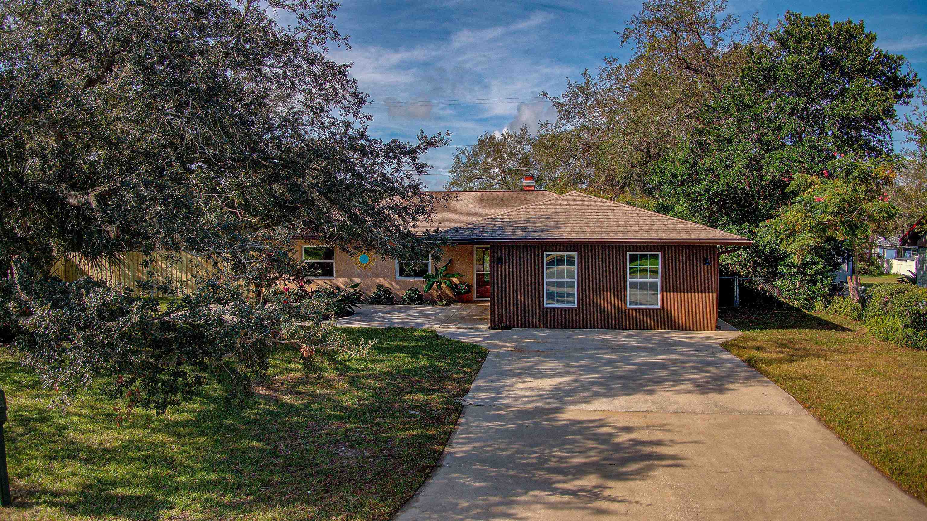 412 Gentian Road St. Augustine, FL 32086 - Photo 11 of 58 a front view of a house with a yard