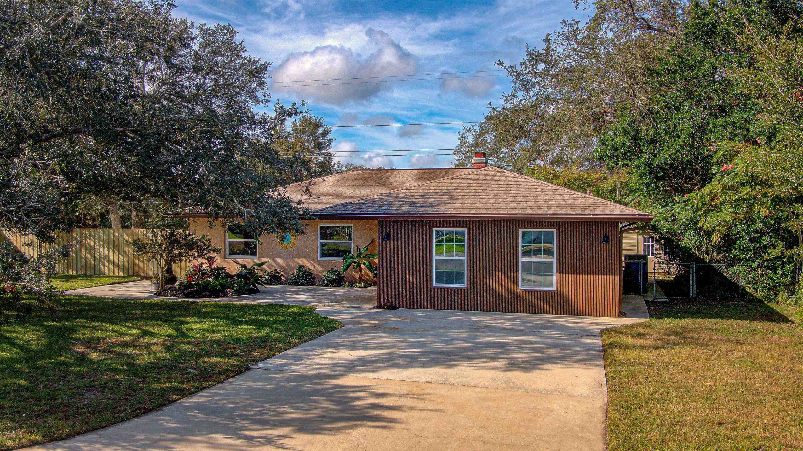 412 Gentian Road St. Augustine, FL 32086 - Photo 12 of 58 a front view of a house with a yard