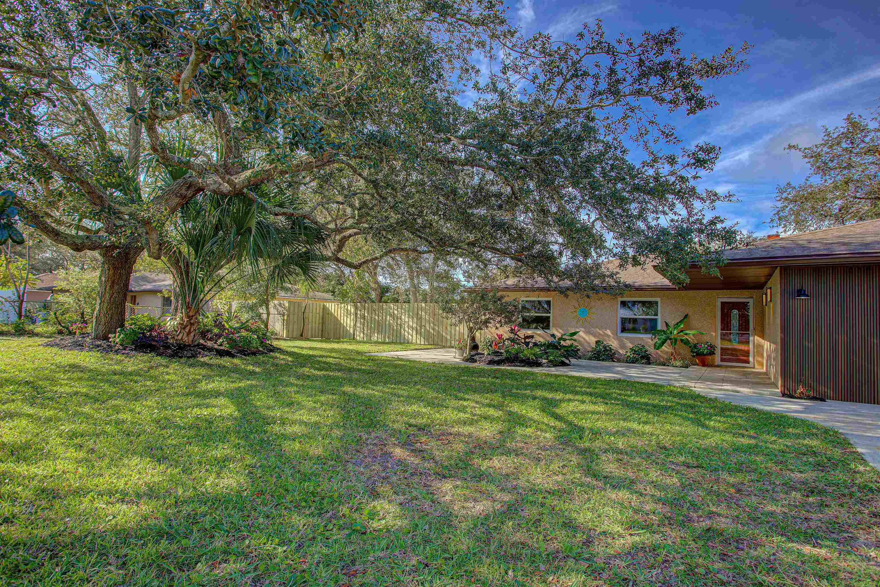412 Gentian Road St. Augustine, FL 32086 - Photo 13 of 58 a house view with a sitting space and garden