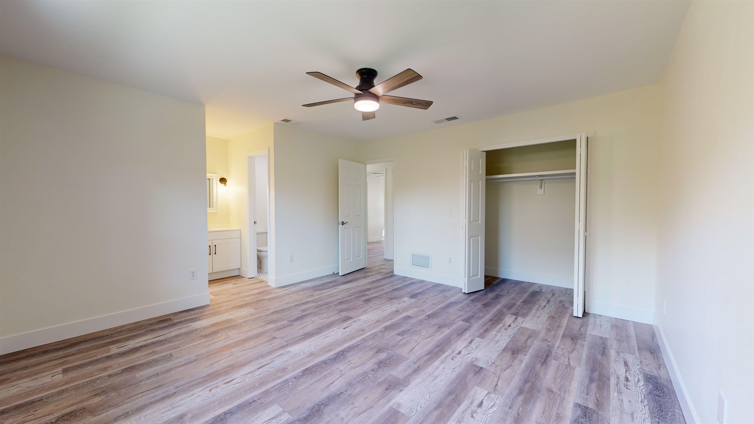412 Gentian Road St. Augustine, FL 32086 - Photo 28 of 58 a view of empty room with wooden floor and fan