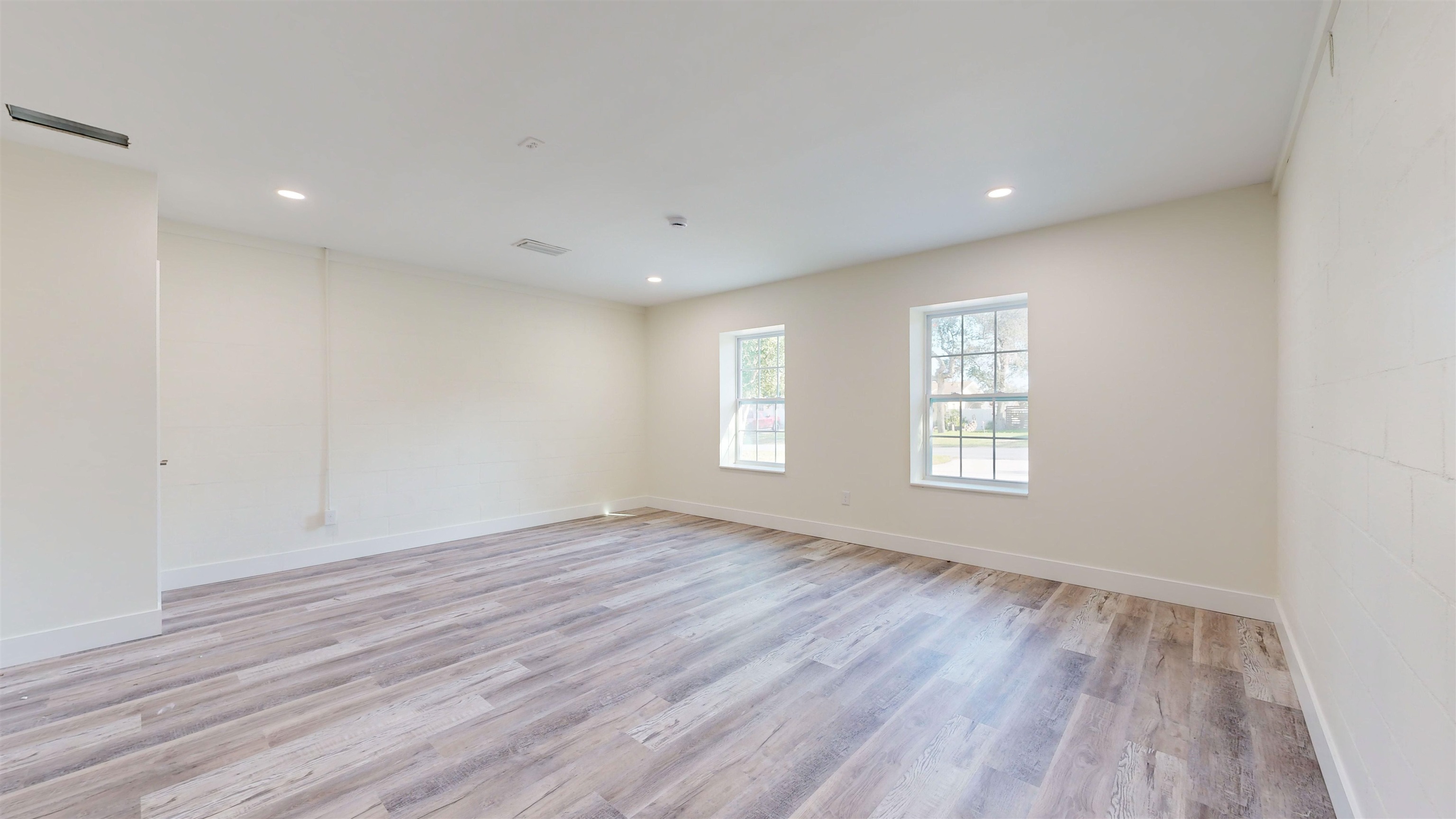412 Gentian Road St. Augustine, FL 32086 - Photo 31 of 58 an empty room with wooden floor and windows