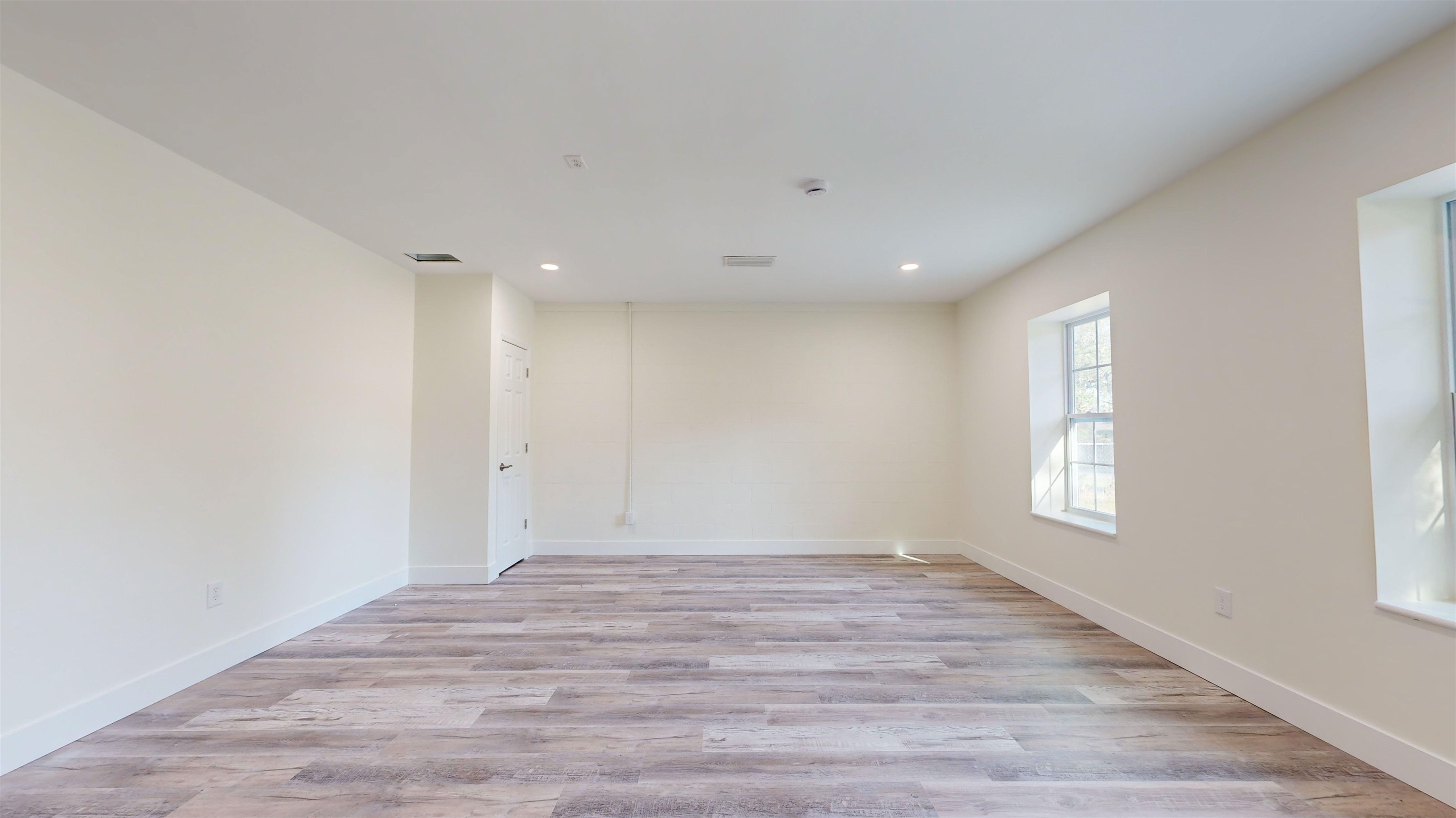 412 Gentian Road St. Augustine, FL 32086 - Photo 32 of 58 a view of an empty room with wooden floor and window