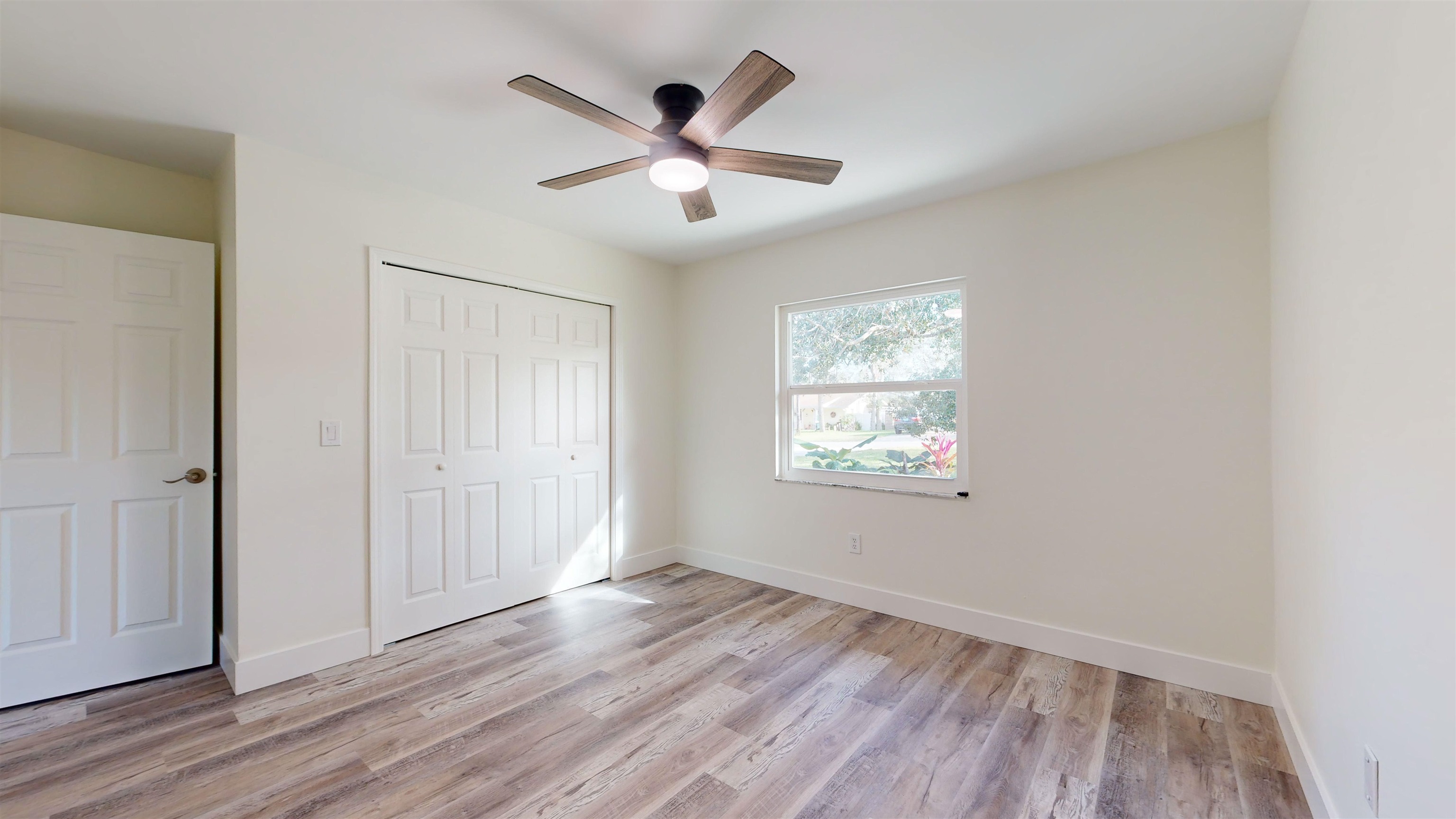 412 Gentian Road St. Augustine, FL 32086 - Photo 37 of 58 a view of an empty room with wooden floor and a window