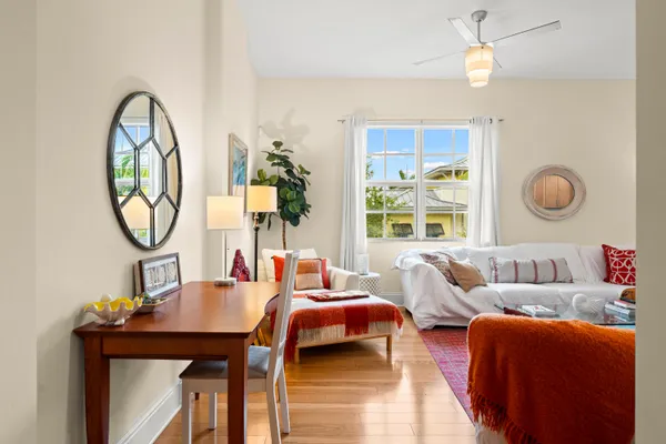 a living room with furniture and a large window