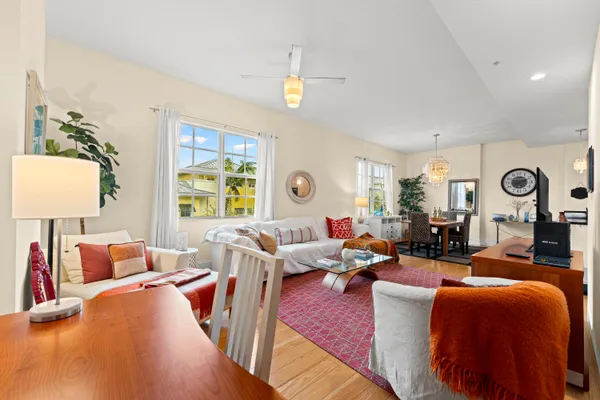 a living room with furniture fireplace and a window
