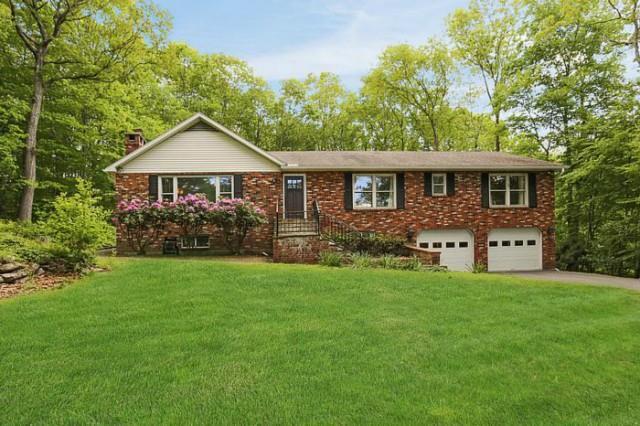 70 Bilberry Road Bridgewater, CT 06752 - Photo 1 of 1 a front view of house with yard and green space