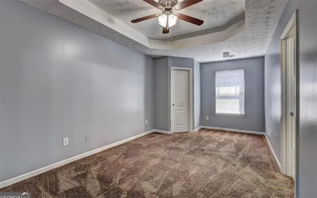 a view of an empty room and window