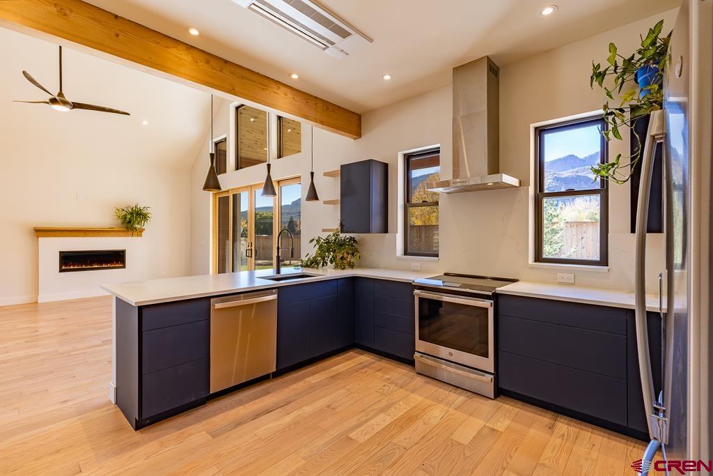 45 West Dalton Road Durango, CO 81301 - Photo 12 of 43 a large kitchen with stainless steel appliances granite countertop a stove and a sink