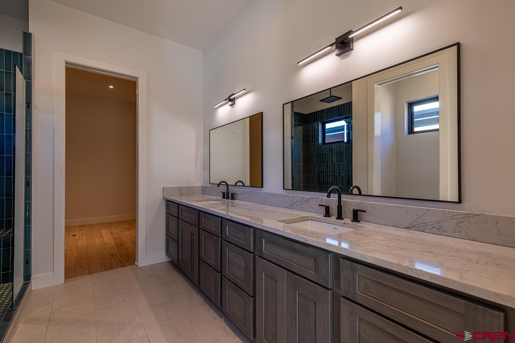 45 West Dalton Road Durango, CO 81301 - Photo 18 of 43 a bathroom with a double vanity sink and a mirror
