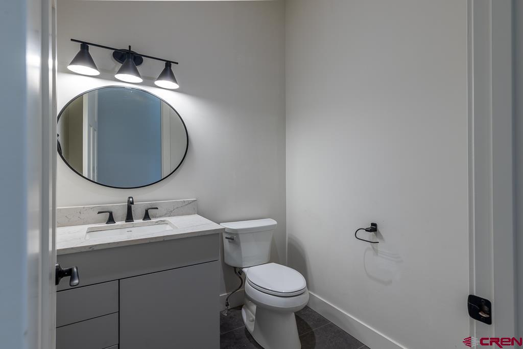 45 West Dalton Road Durango, CO 81301 - Photo 28 of 43 a bathroom with a toilet sink and mirror
