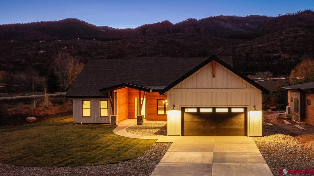 45 West Dalton Road Durango, CO 81301 - Photo 37 of 43 a front view of a house with a yard fire pit table and chairs