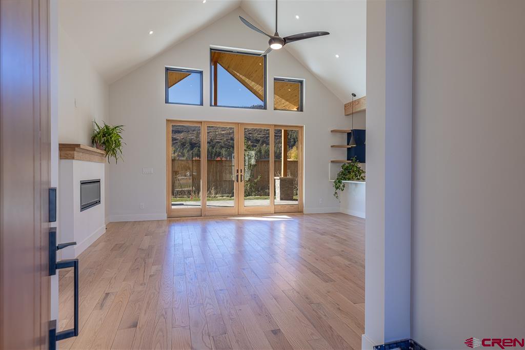 45 West Dalton Road Durango, CO 81301 - Photo 4 of 43 an empty room with wooden floor and windows