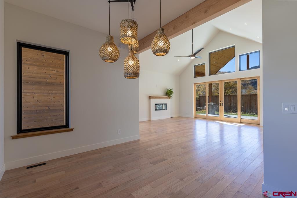 45 West Dalton Road Durango, CO 81301 - Photo 6 of 43 a view of an empty room with wooden floor and a window