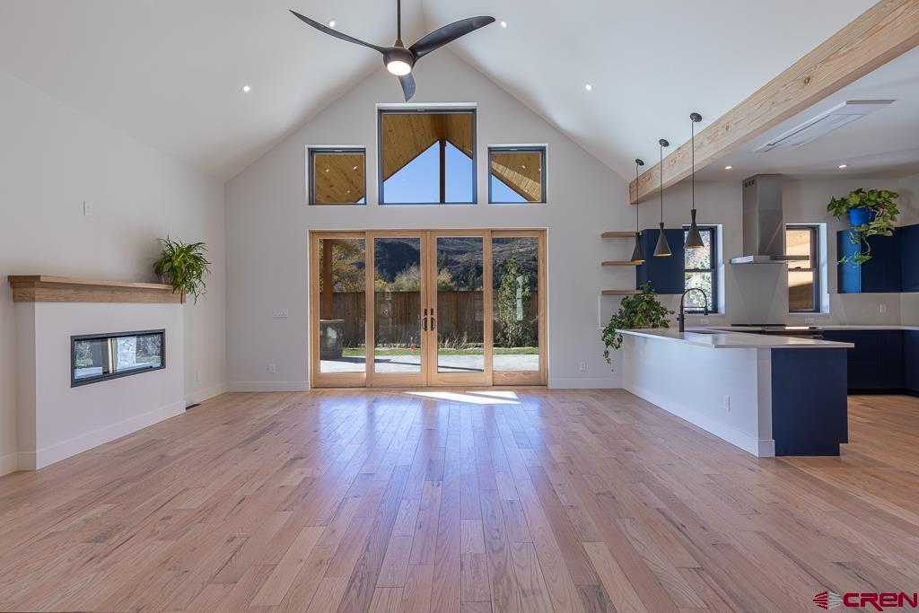 45 West Dalton Road Durango, CO 81301 - Photo 7 of 43 an open kitchen with wooden floors and a fireplace