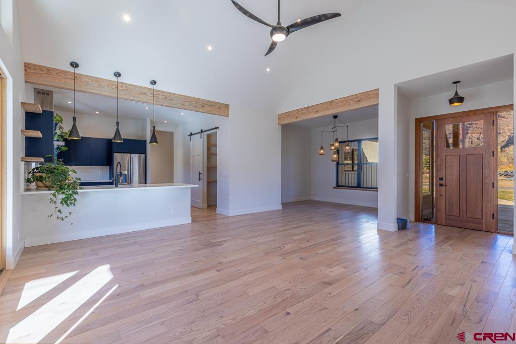 45 West Dalton Road Durango, CO 81301 - Photo 8 of 43 a view of a hallway with wooden floor and a living room