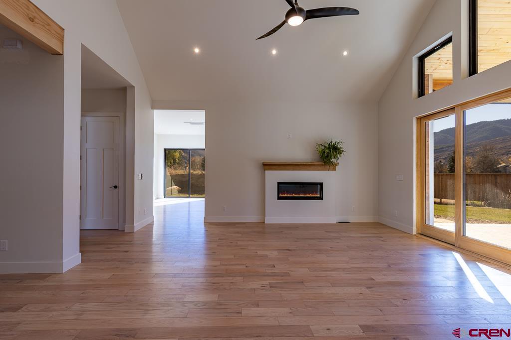 45 West Dalton Road Durango, CO 81301 - Photo 9 of 43 a view of an empty room with window and wooden floor