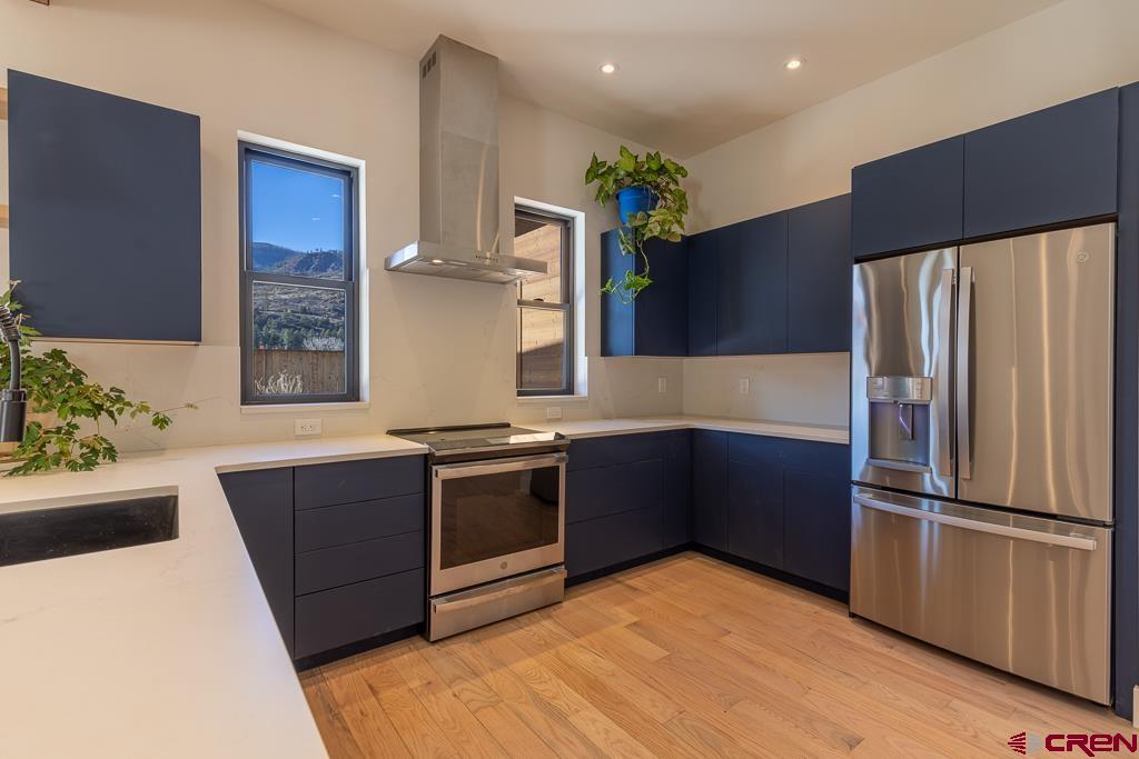 45 West Dalton Road Durango, CO 81301 - Photo 10 of 43 a kitchen with stainless steel appliances granite countertop a refrigerator and a stove