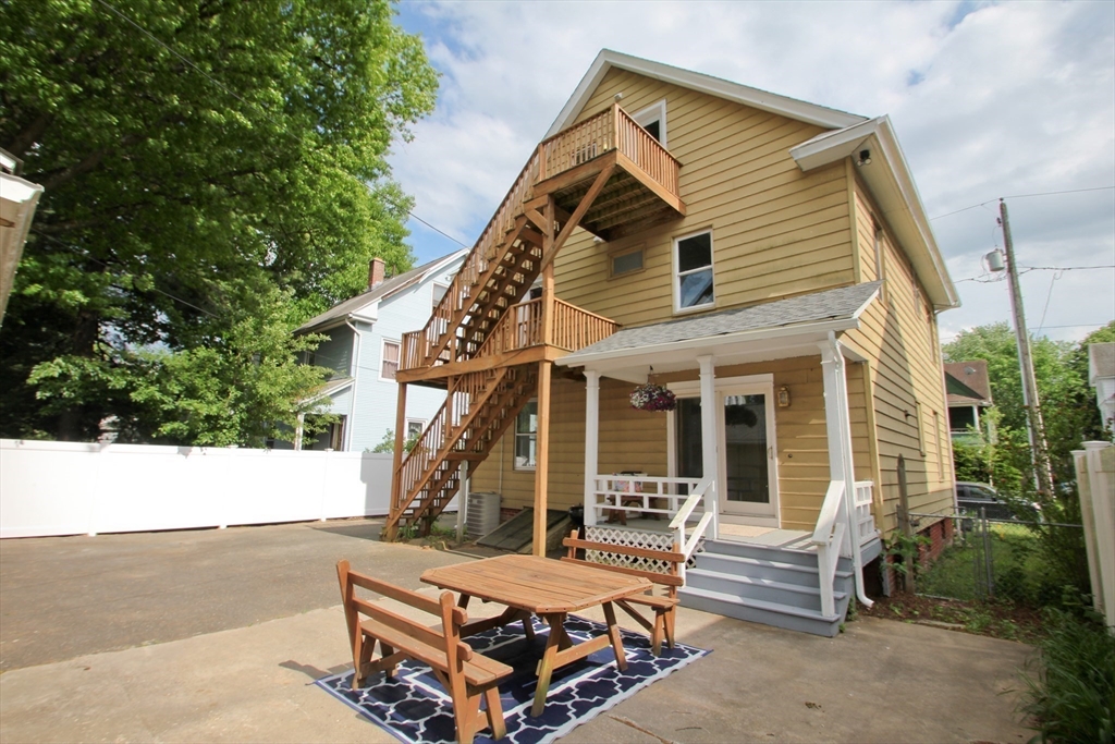 38 Virginia Street Springfield, MA 01108 - Photo 32 of 42 a view of a house with backyard and sitting area