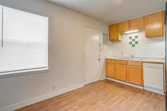 a bathroom with a sink a mirror and a window