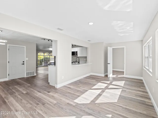 a view of an empty room and window