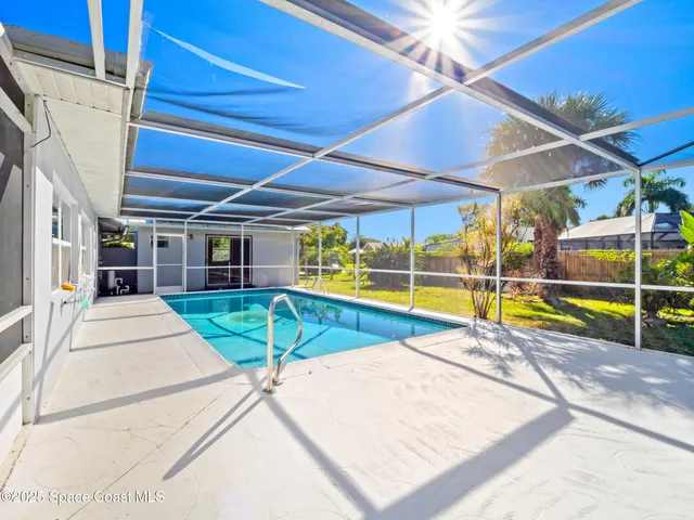 a view of a house with swimming pool