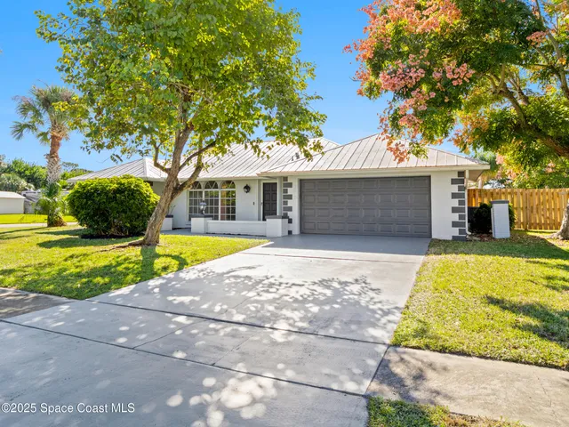 a view of house with swimming pool outdoor seating