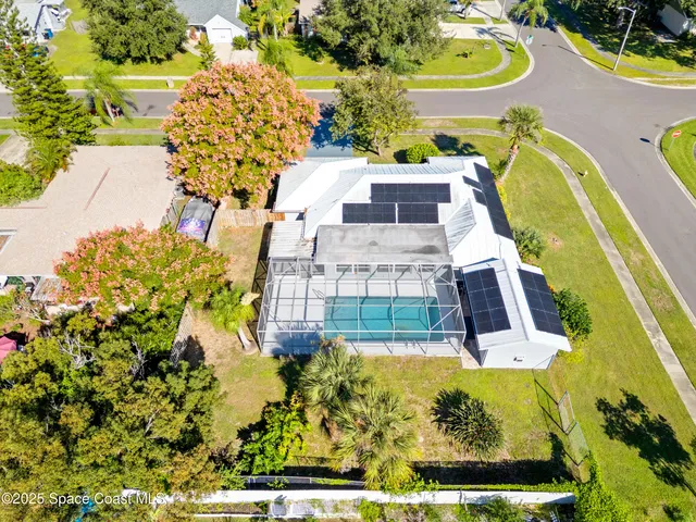 a view of a swimming pool with a yard