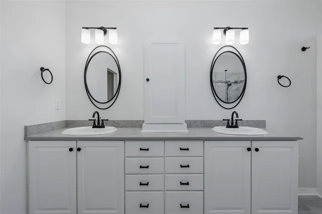 a bathroom with a toilet a sink and a mirror