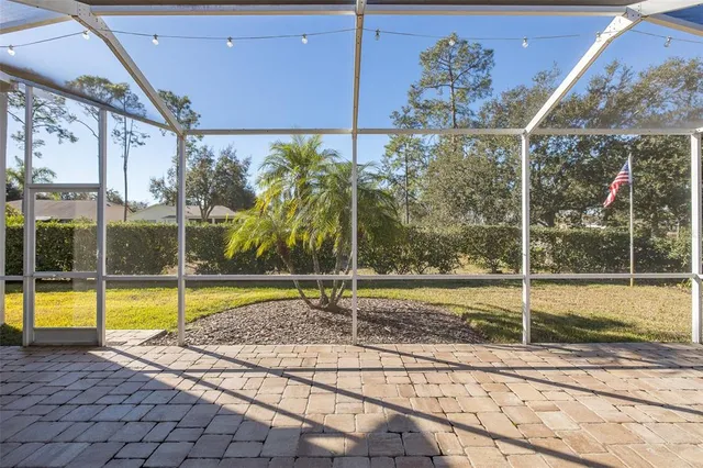 an aerial view of a house with outdoor space
