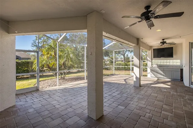 an aerial view of residential houses with outdoor space and ocean view