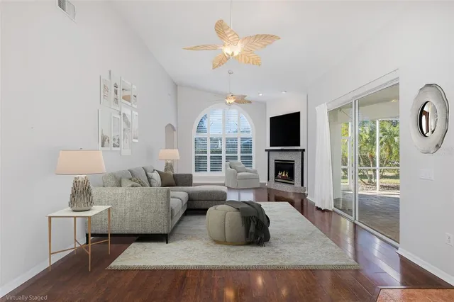 a living room with furniture fireplace and a flat screen tv