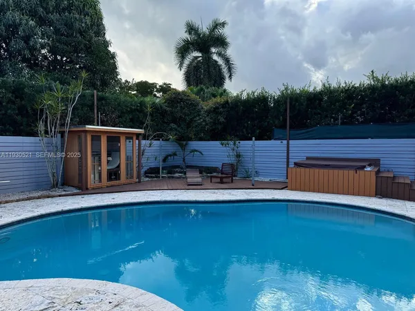a view of a swimming pool with a patio