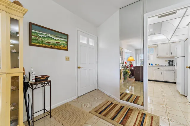 a spacious bedroom with a bed and a view of bathroom
