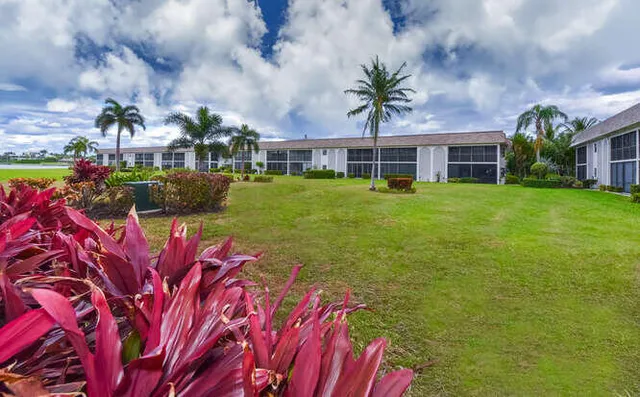 a front view of building with yard