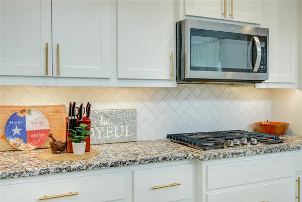 a view of a dining room and livingroom with furniture wooden floor and a large window