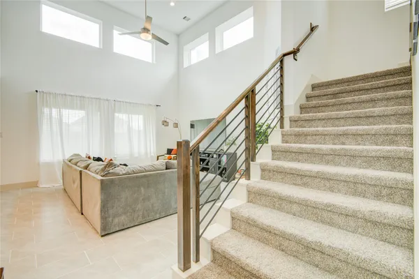 a bathroom with a sink toilet vanity and curtain