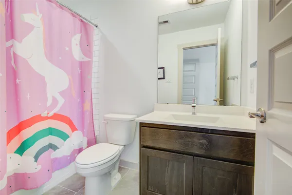 a bathroom with a sink toilet and bathtub