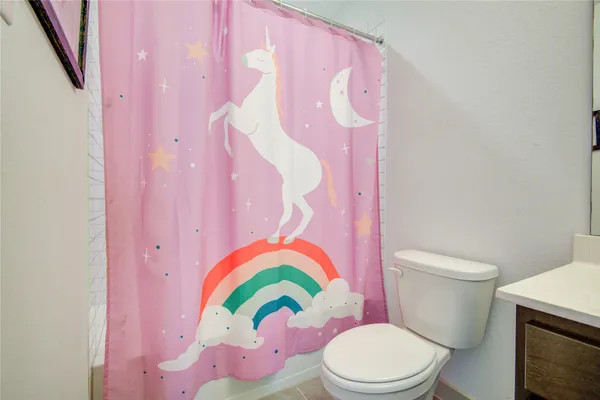 a bedroom with a bed and flat screen tv